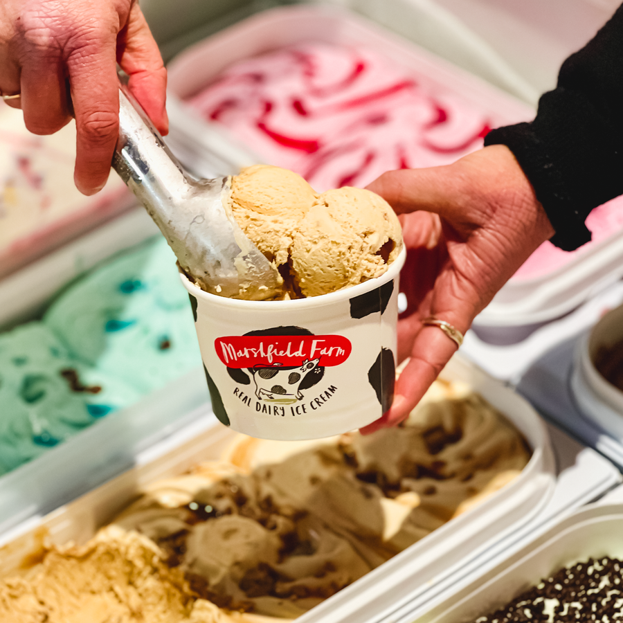 scooping ice cream into tub